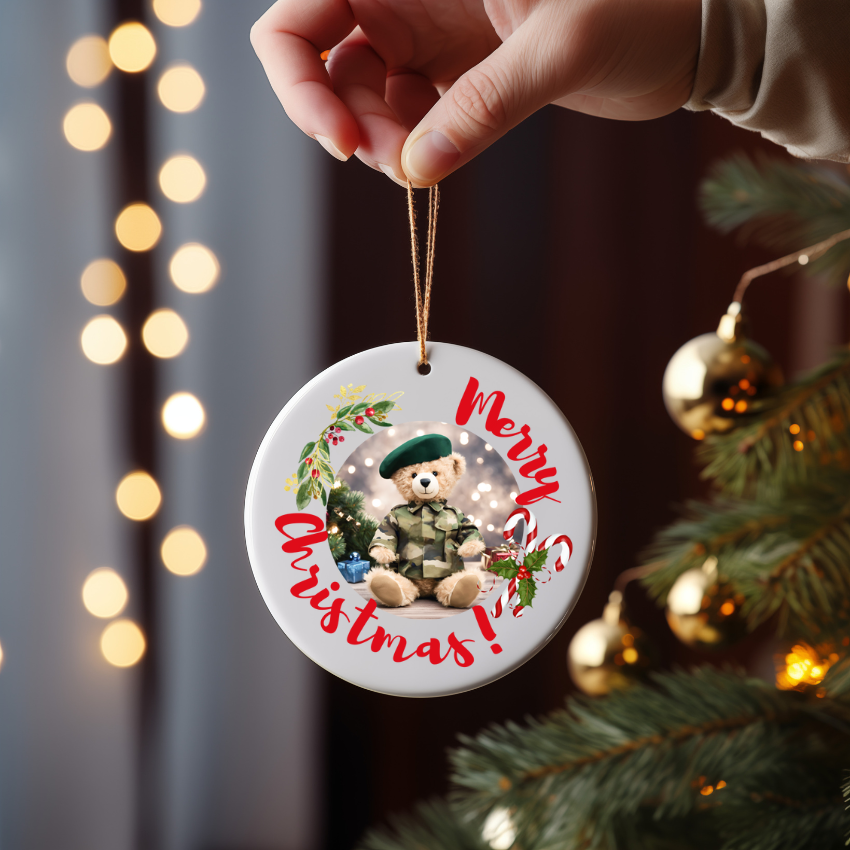 Round ceramic Christmas ornament or gift with military bear, candy cane, and mistletoe on a Christmas tree for Royal Marine family