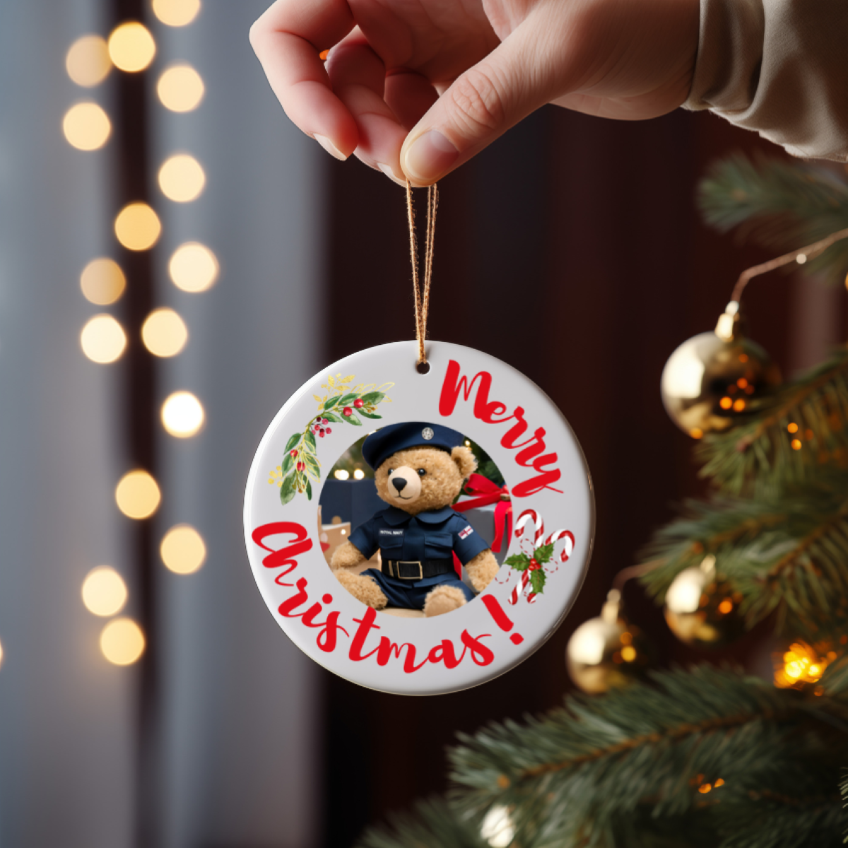 Round ceramic Christmas ornament or gift with Royal Navy military bear, candy cane, and mistletoe on a Christmas tree for any military and royal navy family