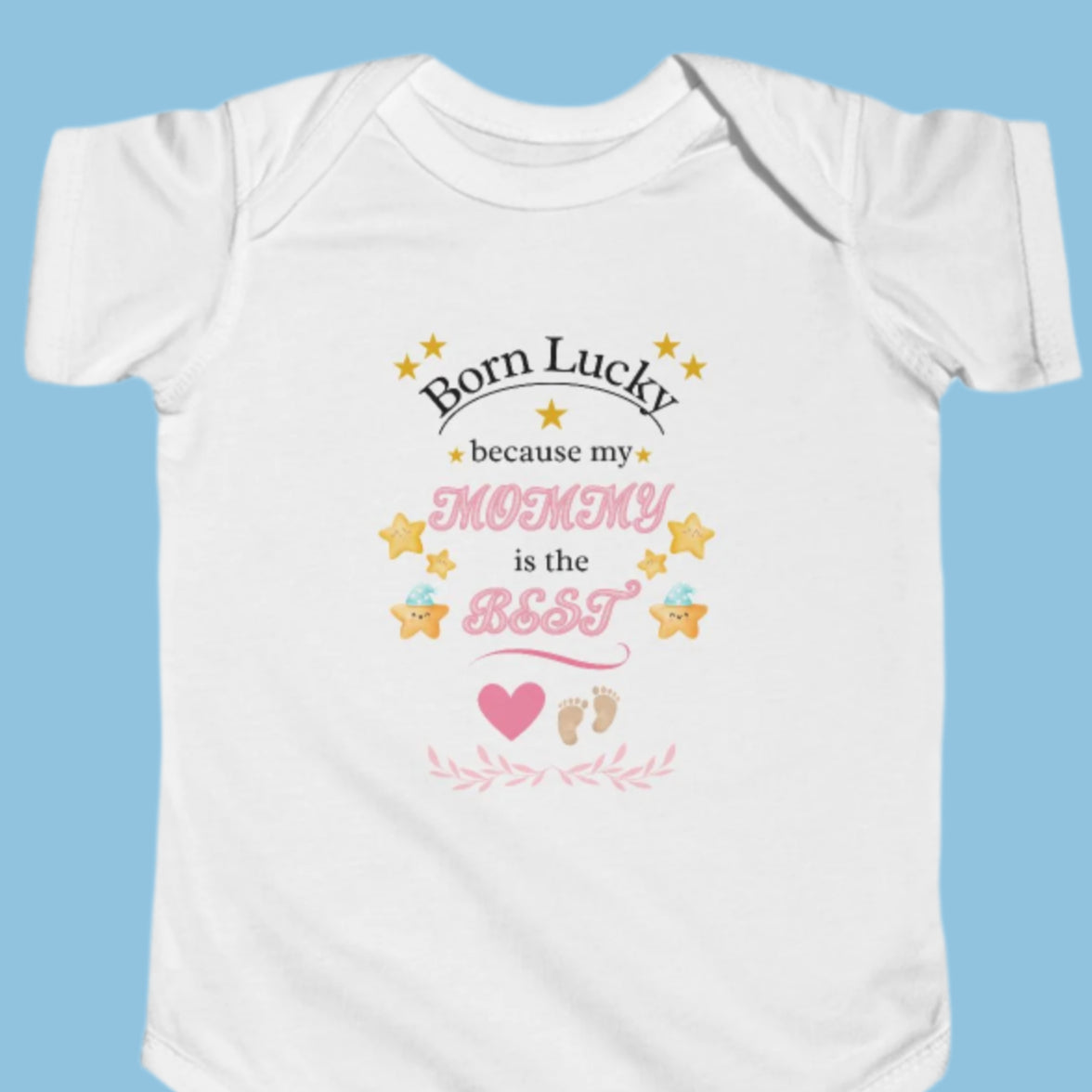 White baby bodysuit featuring 'Born Lucky Because My Mommy is the Best' text in pink writing with gold stars. Soft cotton fabric, ideal for new mom gifts.