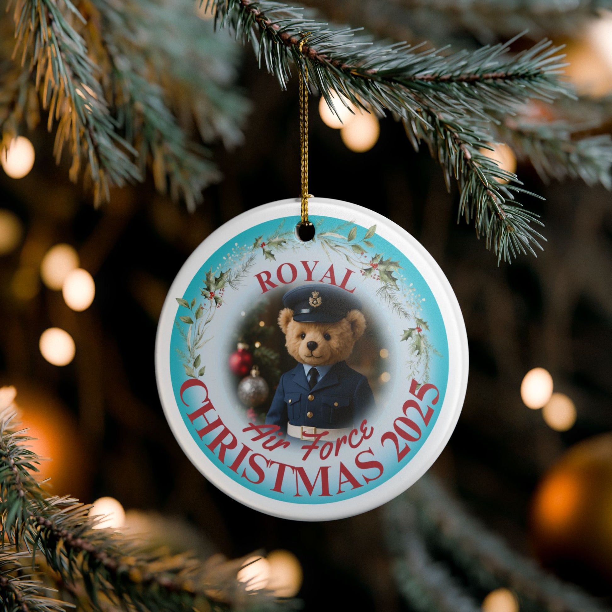 Royal Air Force Christmas ornament 2025 featuring teddy bear in RAF Ones uniform with festive wreath and gold hanging string.