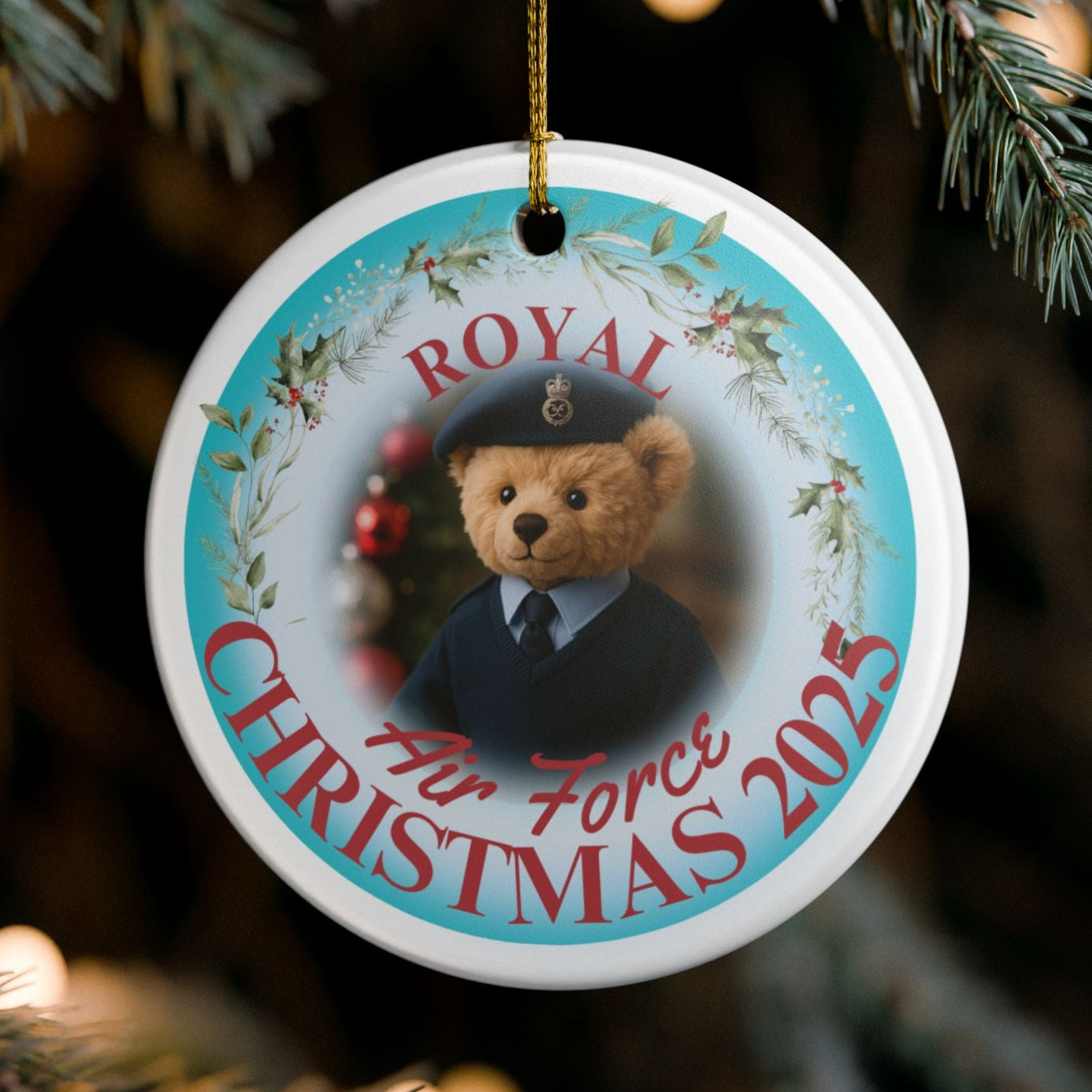 Royal Air Force Christmas ornament 2025 featuring teddy bear in RAF uniform with festive wreath design and gold hanging string.