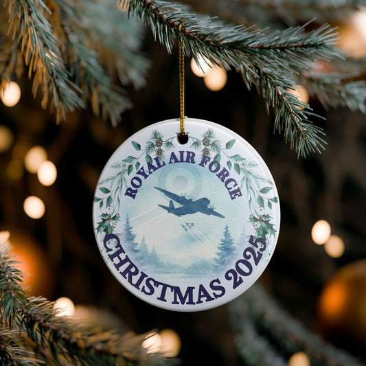 Royal Air Force Christmas ornament 2025 featuring aircraft flying over winter landscape with festive wreath.