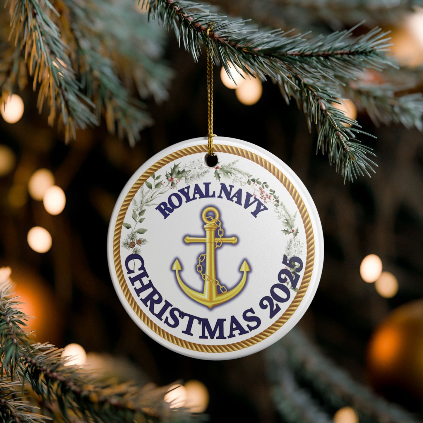 Royal Navy Christmas ornament 2025 featuring gold anchor and rope crest surrounded by festive foliage.
